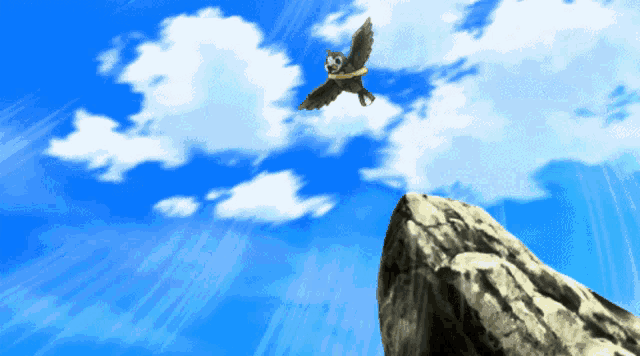 a bird is flying over a rocky cliff
