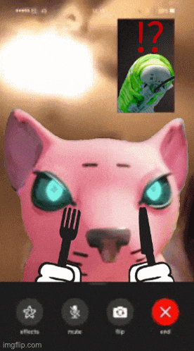 a phone screen shows a pink cat holding a fork and a knife