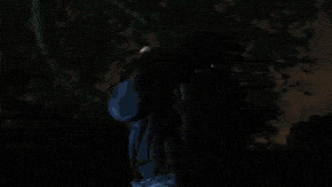 a person 's hand is sticking out of a doorway