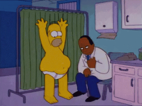 homer simpson is being examined by a doctor in a hospital room