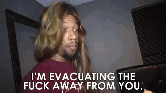 a man wearing a wig says i 'm evacuating the fuck away from you