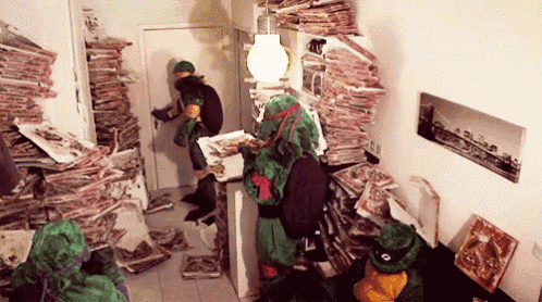 a group of teenage mutant ninja turtles are standing in a room with a lot of magazines