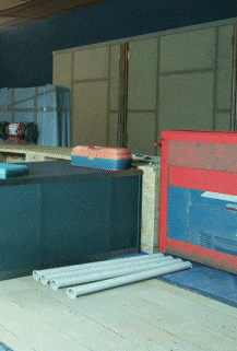 a red and blue box is sitting on a wooden table