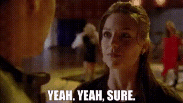 a woman is talking to a man and saying yeah yeah sure