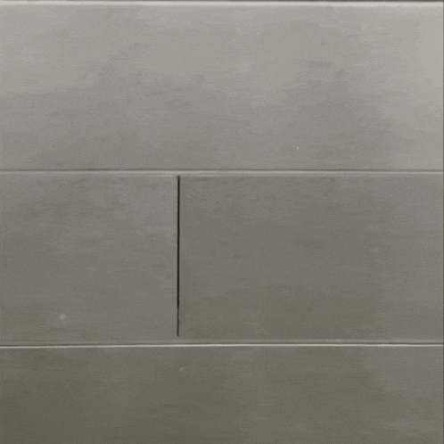 a blurry picture of a man 's face with a gray background .