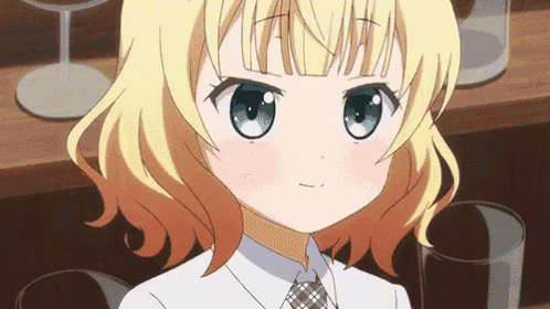 a girl with blonde hair and green eyes looks at the camera