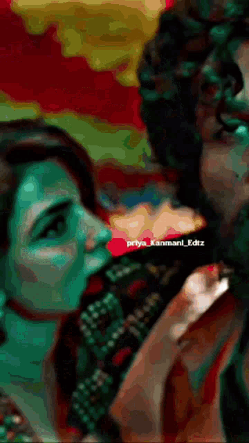 a woman is kissing a man 's cheek in a blurry photo .