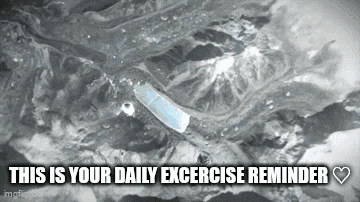 a black and white photo of a bottle of water with the words `` this is your daily excercise reminder '' written below it .