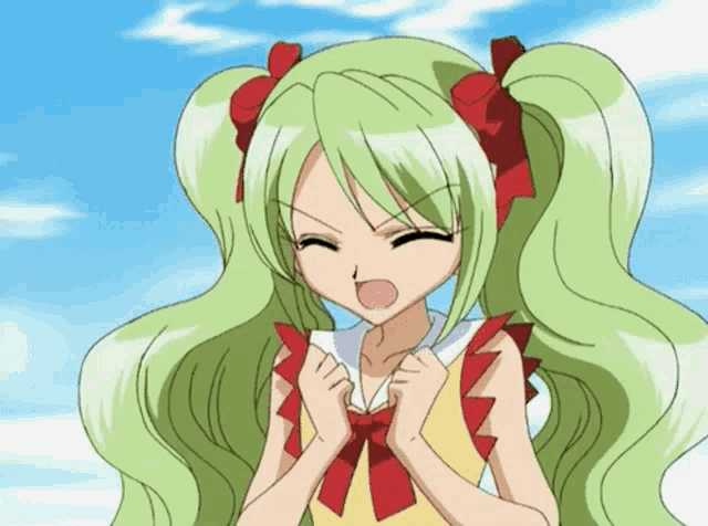 a girl with green hair and a red bow on her hair