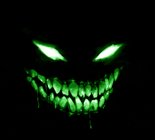 a drawing of a monster 's face with green eyes and teeth