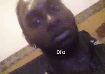 a man with a beard is making a funny face and the word no is on his neck .