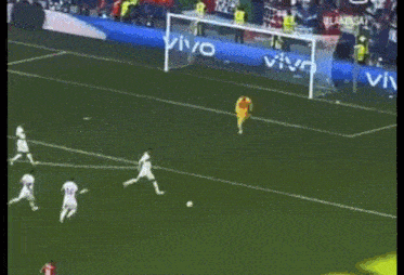 soccer players on a field with a banner that says vivo