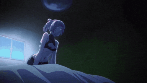 a girl in a bra is sitting on a bed in a dark room