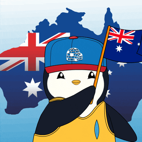 a penguin wearing a blue hat holds an australian flag in front of an australian map