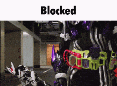 a picture of a robot with the word blocked on the bottom