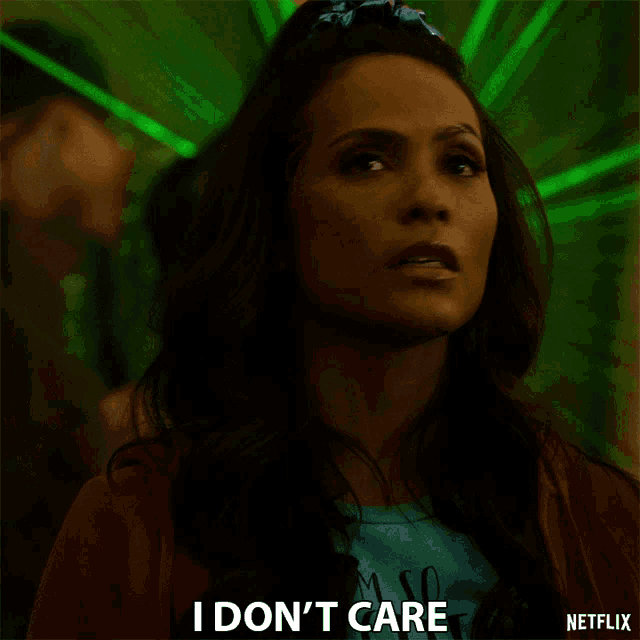 a woman says i don t care in front of a green background