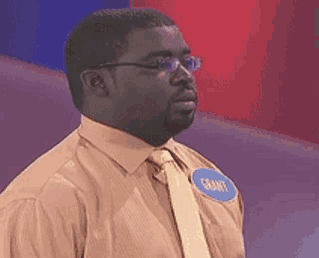 a man with a name tag that says grant on it