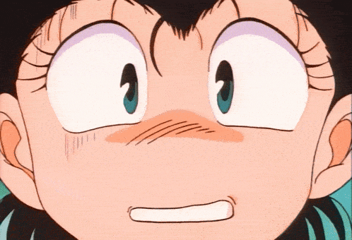 a close up of a child 's face with a surprised look on her face