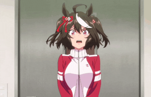 a girl in a red and white jacket with a letter t on it