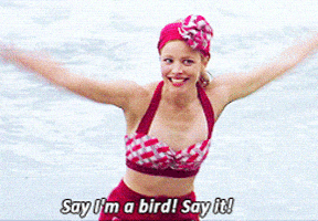 a woman in a bathing suit says " say i 'm a bird say it "