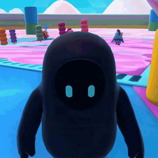 a cartoon character with a black face and blue eyes is standing on a pink surface