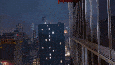 a man in a spiderman costume is doing a handstand on a building