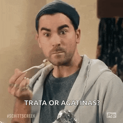a man is eating food with a spoon and saying `` trata or agtinas ? ''