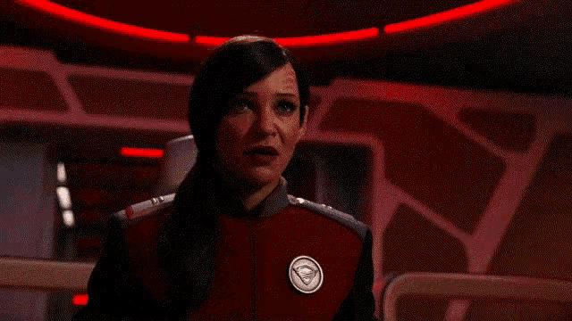 a woman in a red jacket says fire