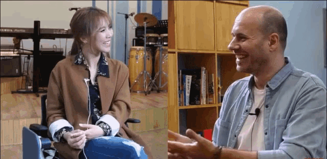 a man and a woman are having a conversation in a room