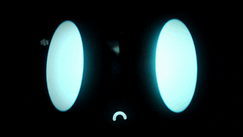 a black background with blue circles and a drop in the middle
