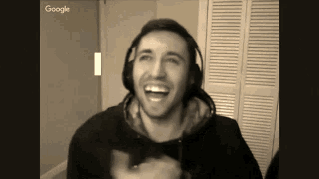 a man wearing headphones is laughing in a google ad