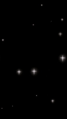 a young man in a black shirt is smiling in a circle with stars around him