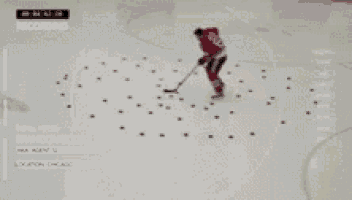 a hockey player is laying on the ice with the words recording visible
