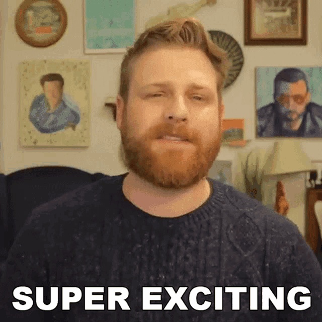 a man with a beard says super exciting in front of paintings on the wall