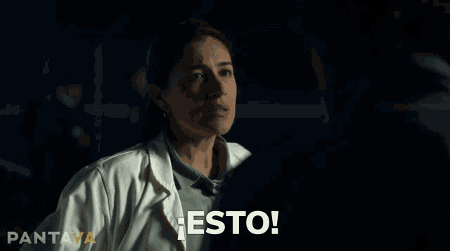 a woman in a white lab coat says " esto "