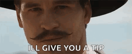 Tombstone Doc Holliday GIF - Tombstone Doc Holliday Wink GIFs