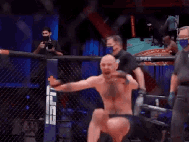 a man in a boxing ring with a espn logo on the side
