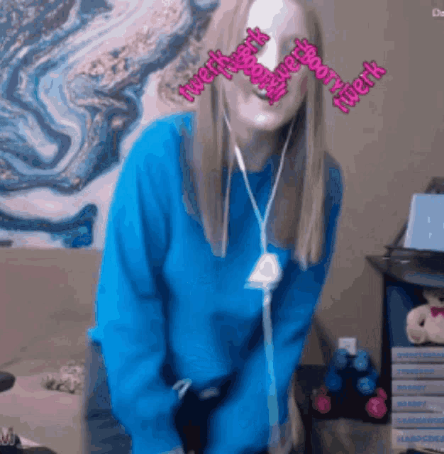 a woman wearing a blue sweater with the words twerkbooty twerk written on her face