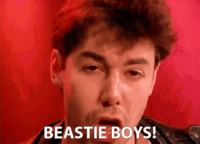 a man with his mouth open and the words beastie boys written on his face