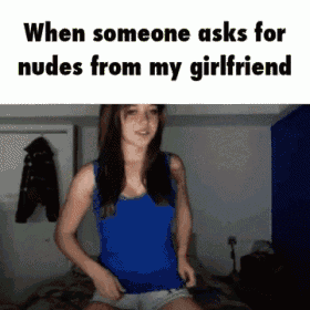 a woman in a blue tank top is sitting on a bed and says when someone asks for nudes from my girlfriend