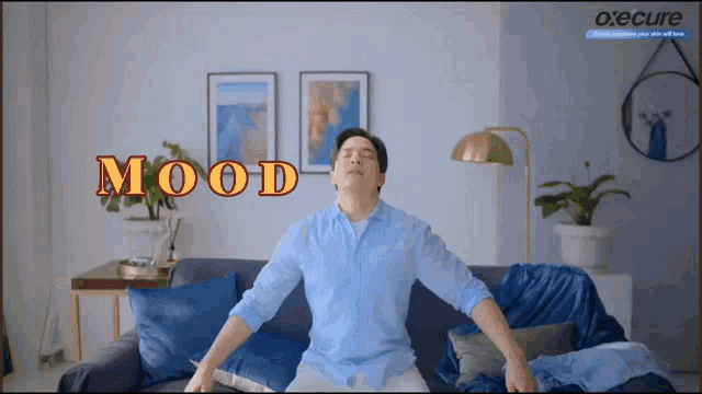 a man is sitting on a couch with his eyes closed and the word mood behind him