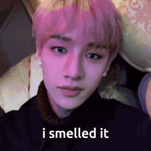 a close up of a person 's face with the words i smelled it on the bottom