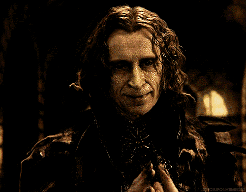 a close up of a man 's face with the words once upon a time gif written on the bottom