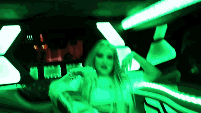 a blurry picture of a woman in a neon green light