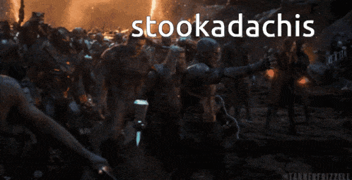 a captain america holding a hammer with the words stookadachis written above him