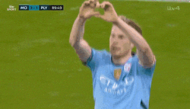 a man in a blue etihad airways jersey waves to the crowd