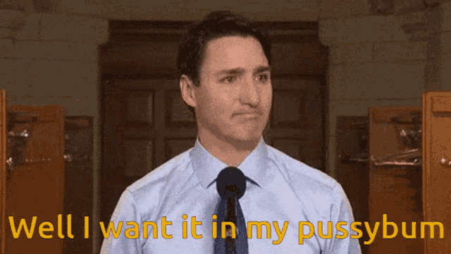 a man in a blue shirt and tie is saying well i want it in my pussybum