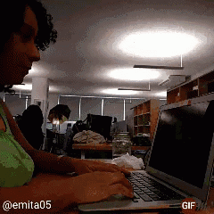 a gif of a woman typing on a laptop with the hashtag @ emita05