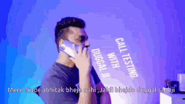 a man is talking on a cell phone with the words call testing behind him