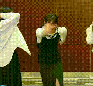 a group of girls are dancing in front of a mirror .